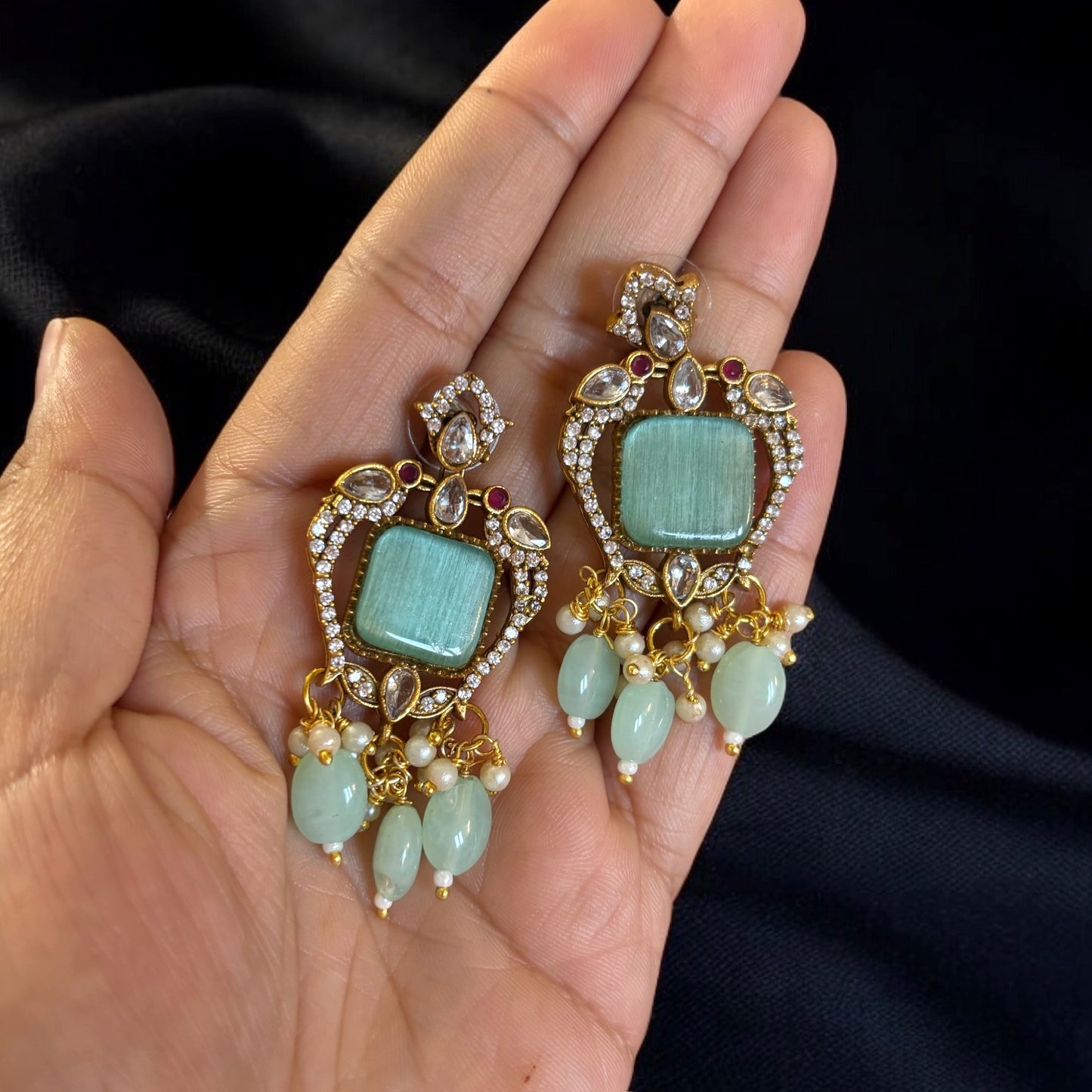 Gold plated pastel green earrings