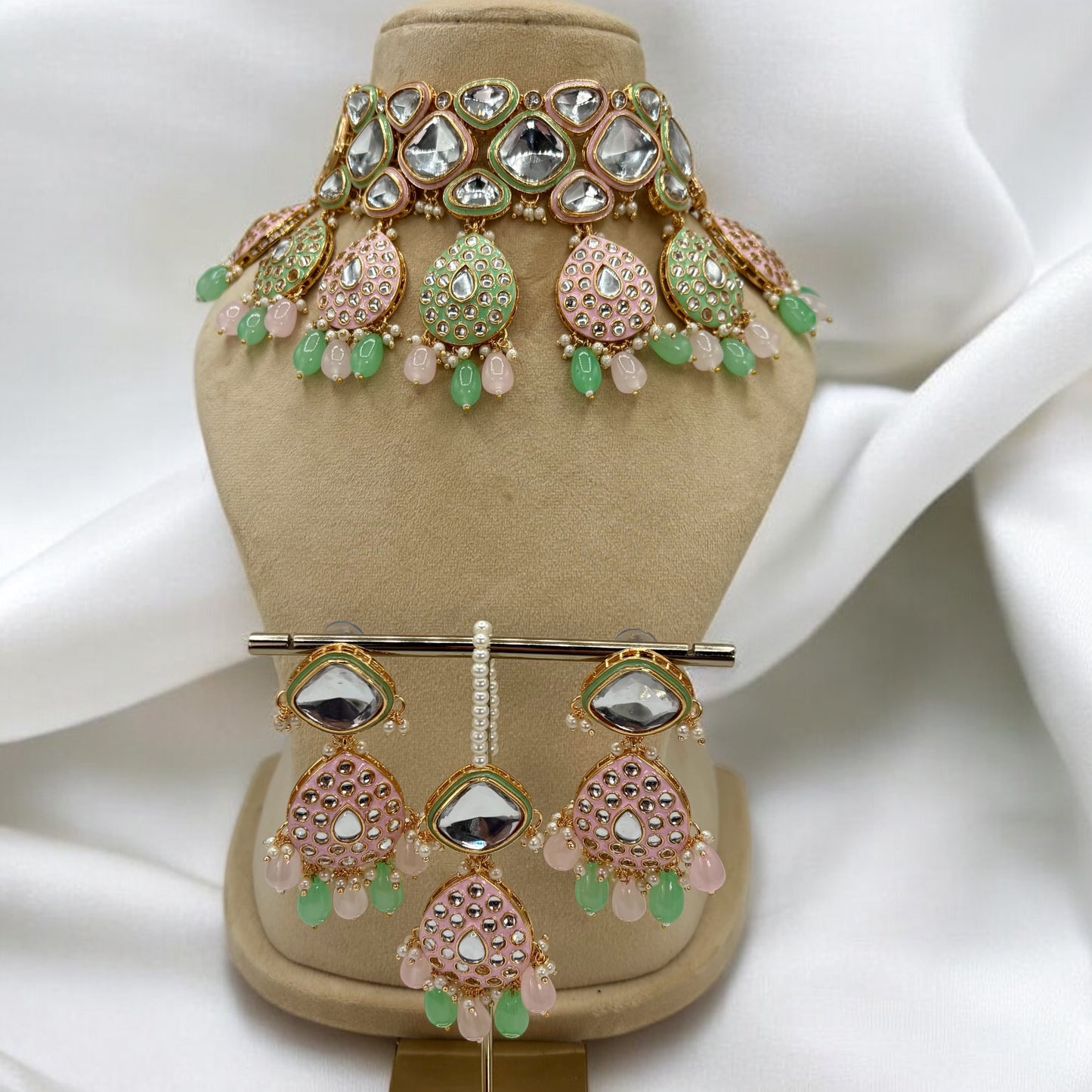 Party wear pastel pink and mint colour choker set with earrings and mang tikka.