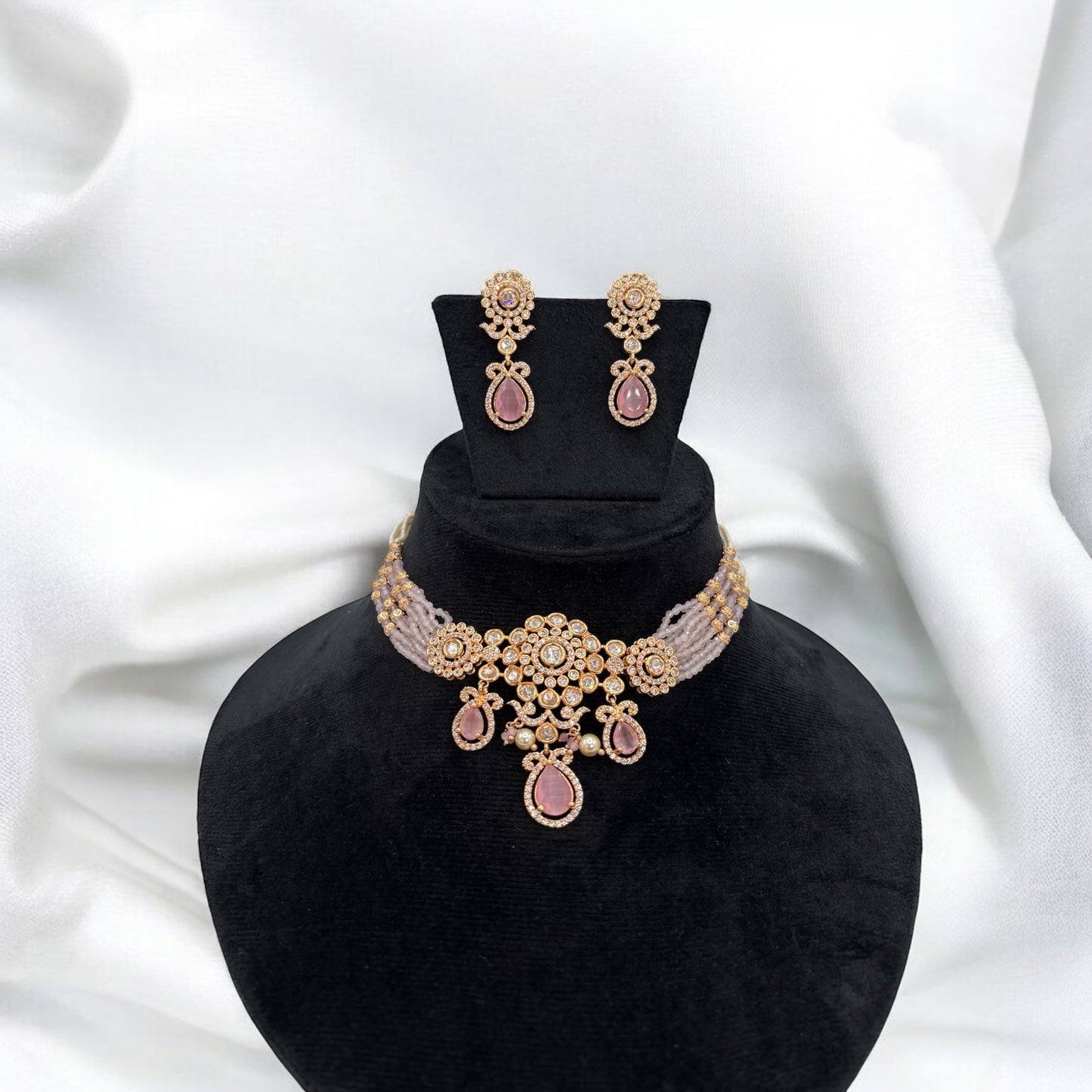 Very elegant rose gold plated pink choker set with kundan and pink stones.