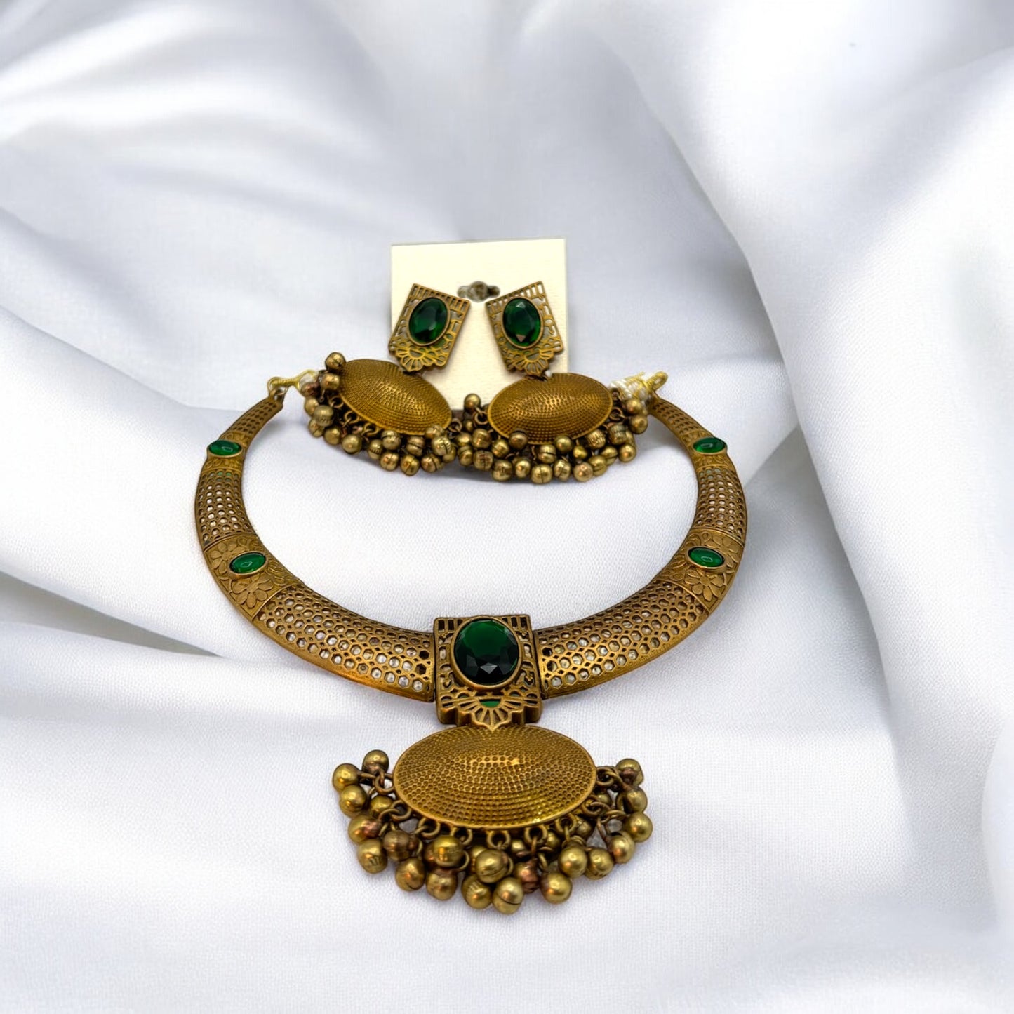 Contemporary gold necklace set in red and green colour stones with earrings