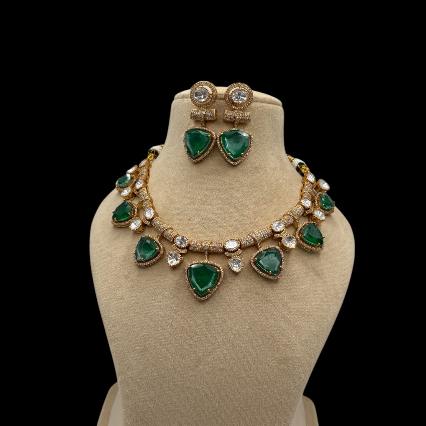 Premium quality gold plated kundan and mossanite necklace set with emerald green stones.