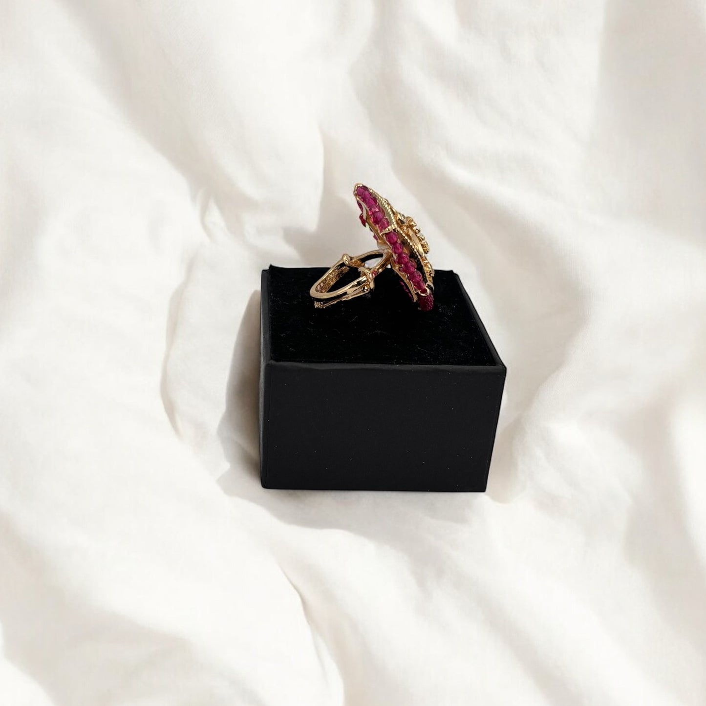 Green, pink and white Kundan rings