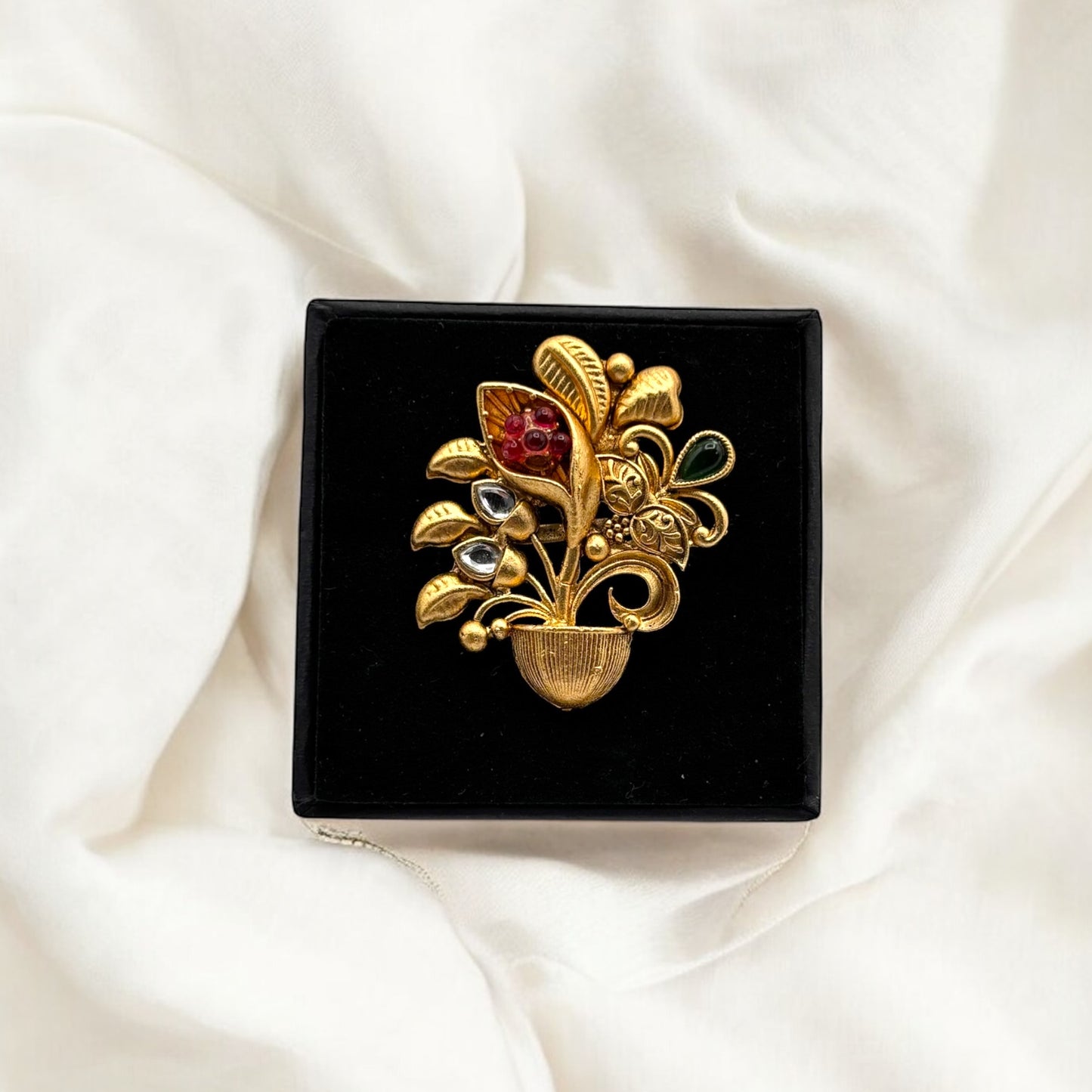 Gold plated adjustable ring.