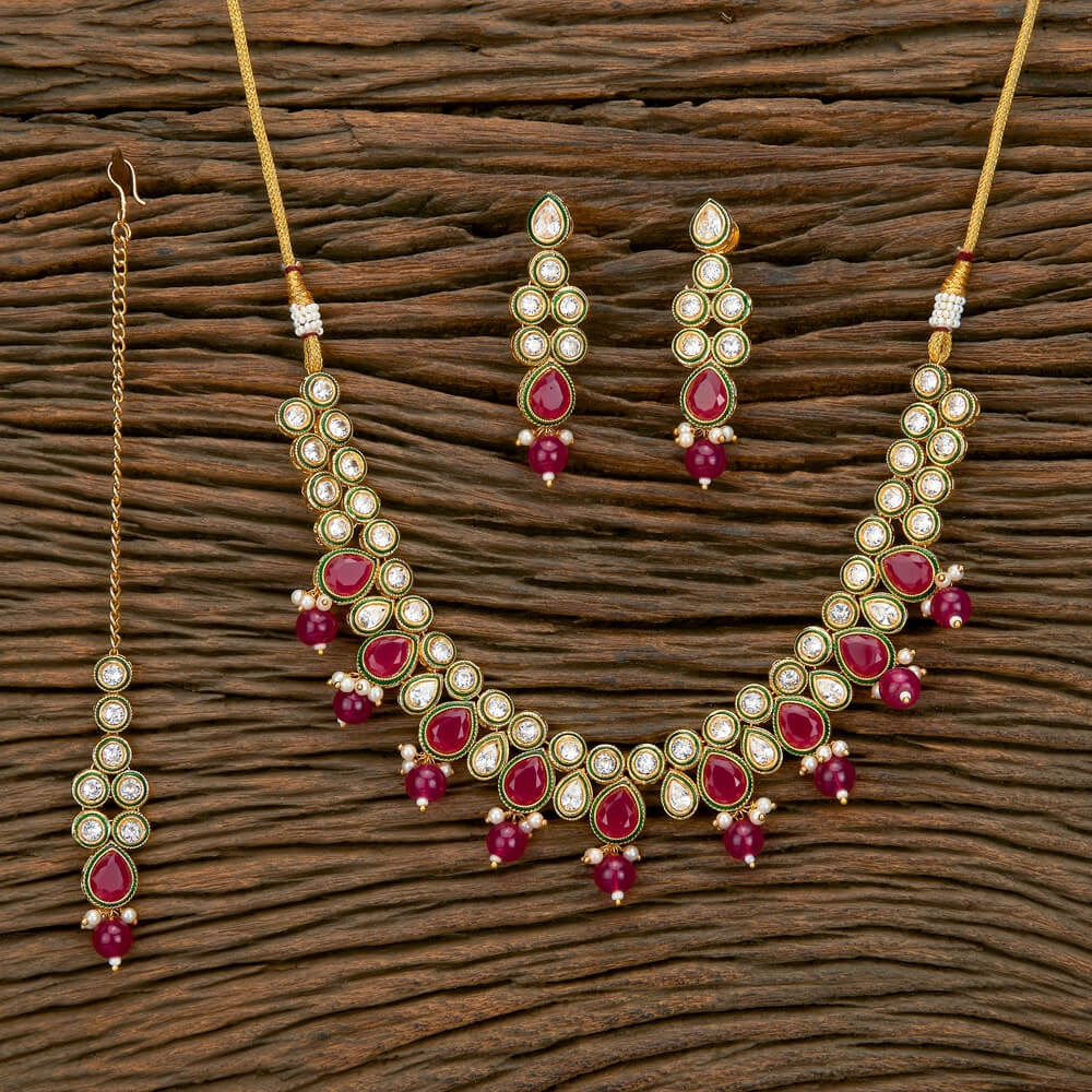 Kundan necklace set with ruby color stones