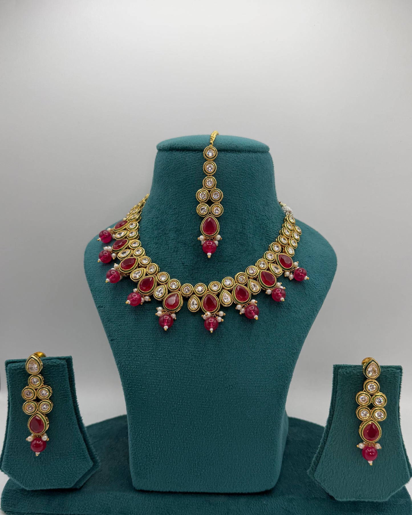 Kundan necklace set with ruby color stones