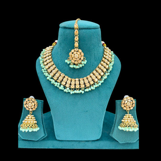 Beautiful mint green stones polki necklace set with jhumki and matha tikka.
	•