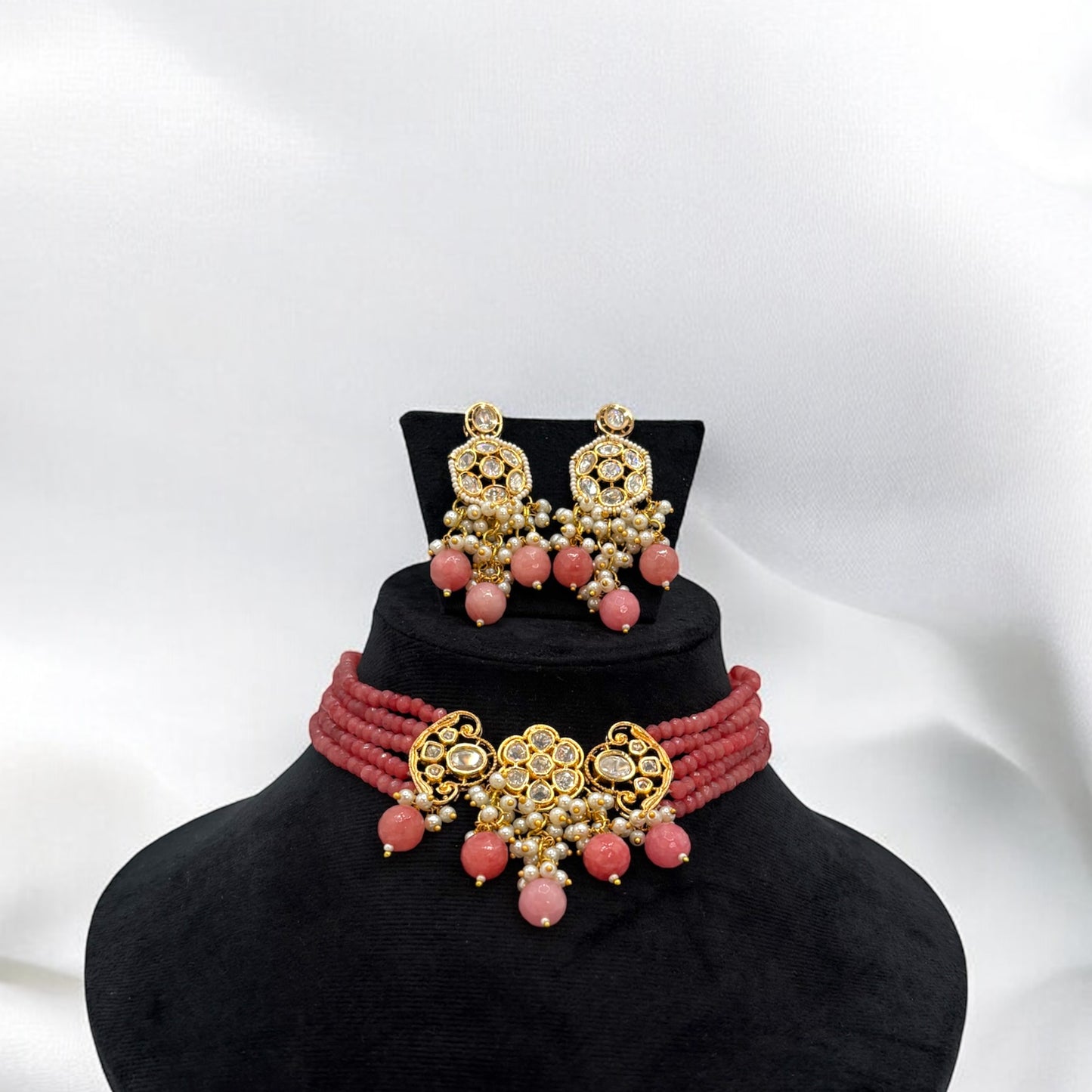 Gold plated kundan choker set with pink onyx stones