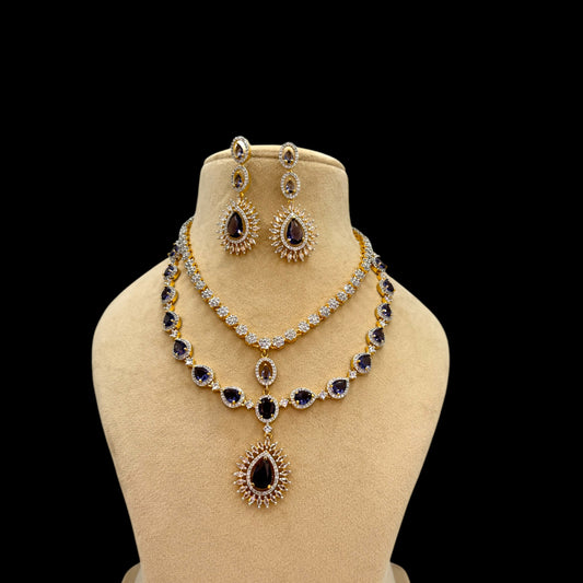 Two layer gold plated American Diamond necklace set with purple stones.