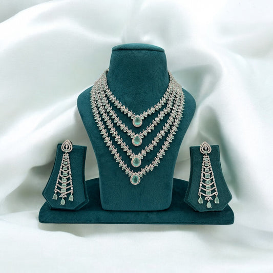 Four layer American Diamond pastel green necklace set with big earrings.