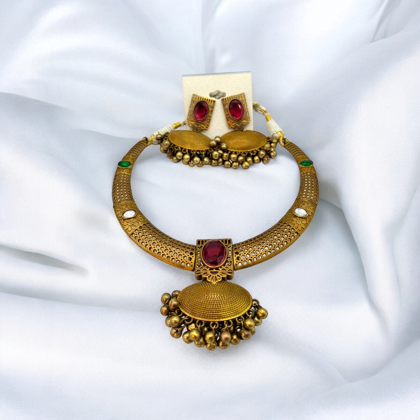 Contemporary gold necklace set in red and green colour stones with earrings