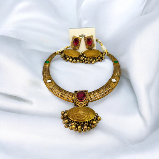 Contemporary gold necklace set in red and green colour stones with earrings