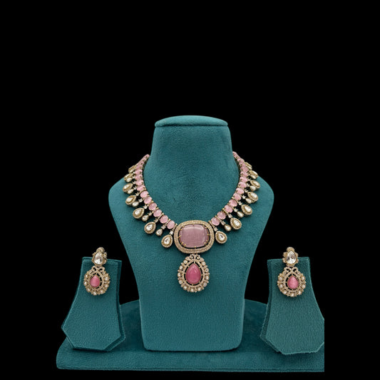 Premium quality pink necklace set with moissanite  and kundan stones paired with earrings.