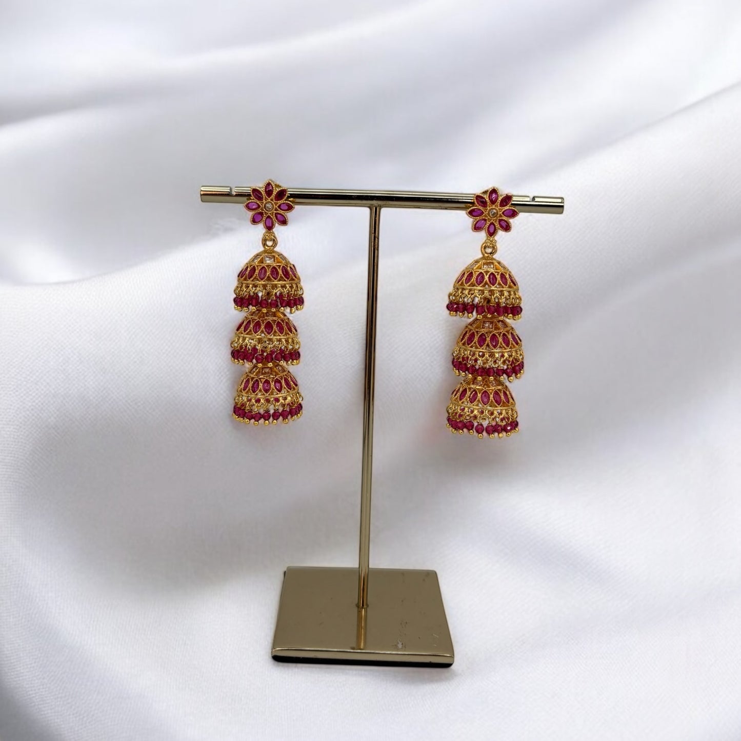 Gold tone three layered jhumki earrings