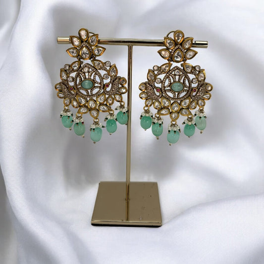 Kundan earrings with pastel green stones