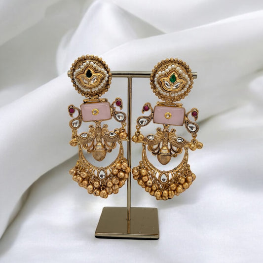 Handmade gold tone pachi kundan earrings.