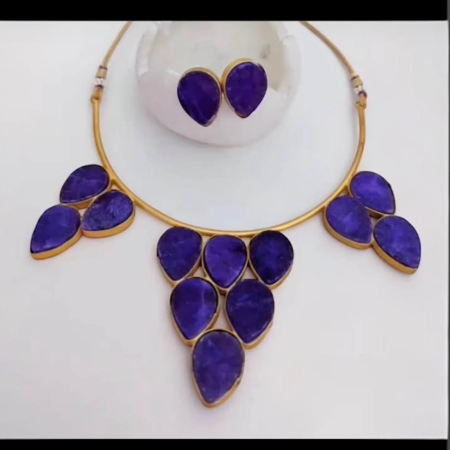 Gold plated hasli with purple natural stones
