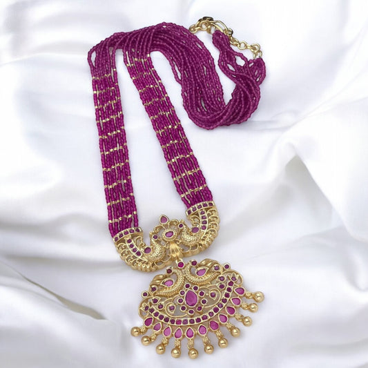 Long beaded mala with ruby stones and pendant