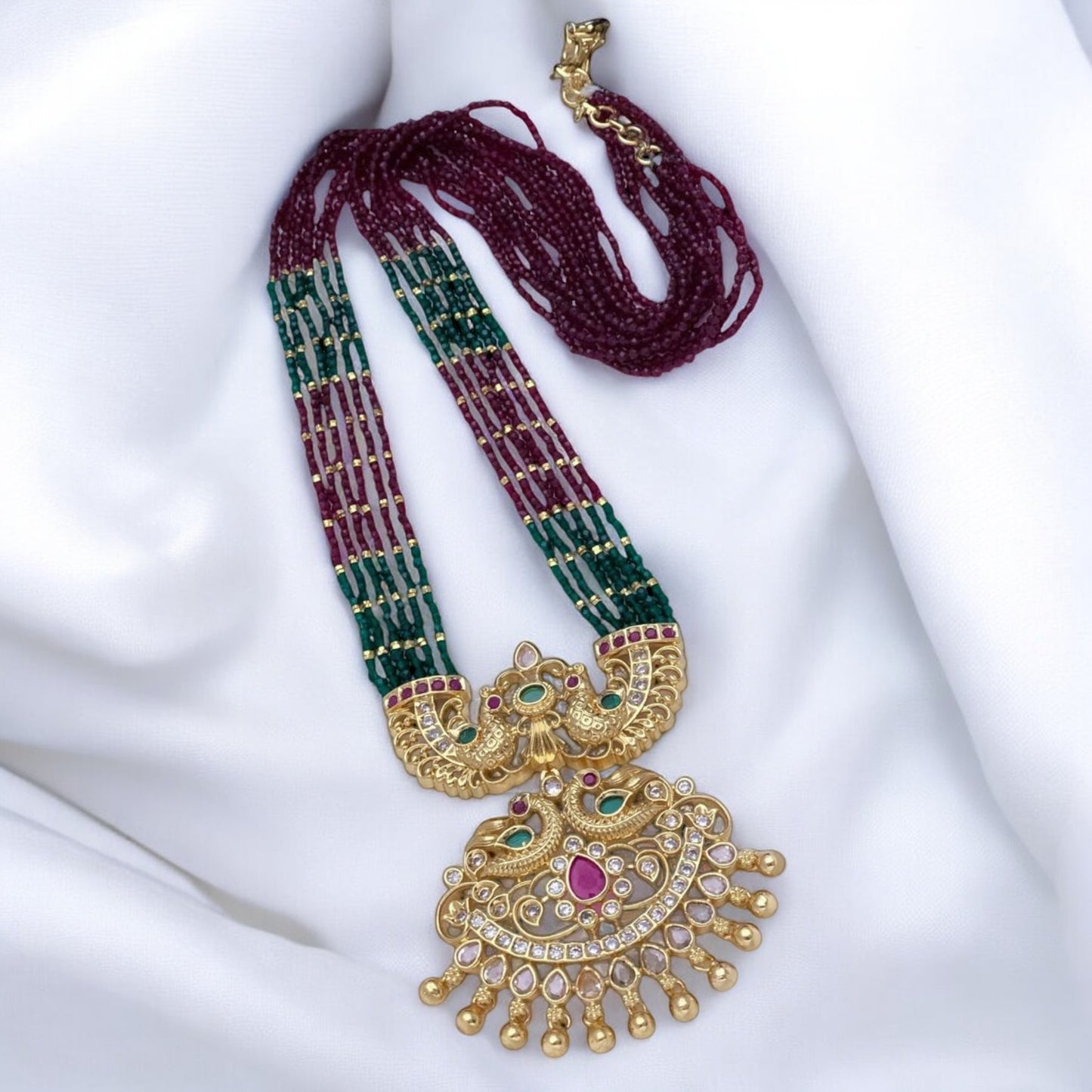 Long beaded mala with ruby stones and pendant