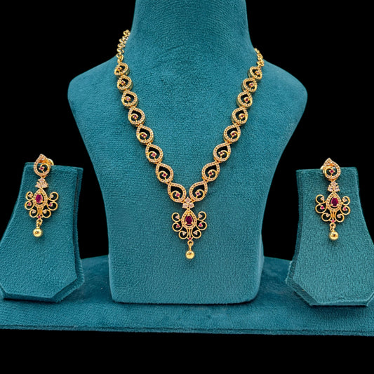 Gold plated American Diamond necklace set with earrings.