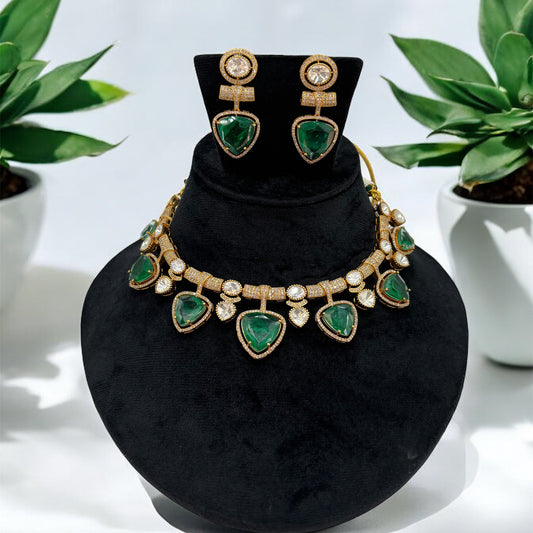 Premium quality gold plated kundan and mossanite necklace set with emerald green stones.